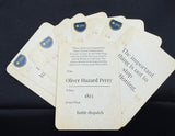 Stack of historical documents with text and a signature on a dark fabric background
